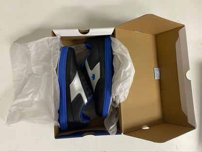 Black and blue sneaker inside a cardboard box on a white surface